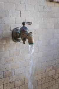 Large Spanish fountain made of brick with unique metal water nozzle