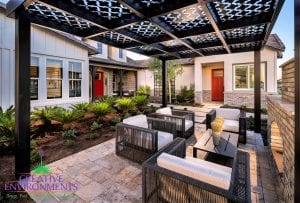 Custom outdoor landscape in Arizona front yard lounge area with custom metal pergola
