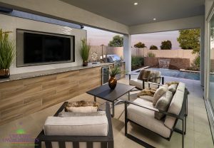 Creative Environment design and landscape in Scottsdale showing covered patio area with built in television and seating area