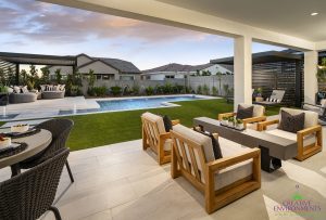 Creative Environments design and landscape at Allevare Catalan Model showing large custom backyard with covered patio and seating near pool