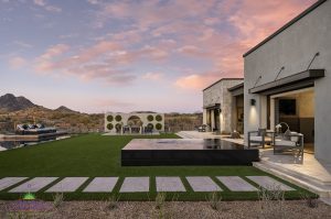 Creative Environments design and landscape at Sereno Canyon Mayne Model showing a large custom backyard with grass and hot tub
