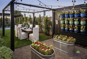 Creative Environments custom backyard design with outdoor dining near floating garden