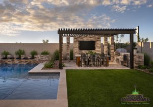 Creative Environments design and landscape Preserves at San Tan Model showing custom backyard with large metal pergola and seating