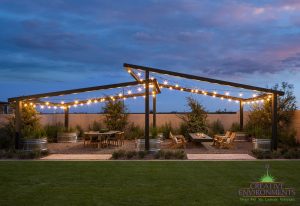 Creative Environments design and landscape Preserves at San Tan Model showing custom backyard with patio seating and string lights