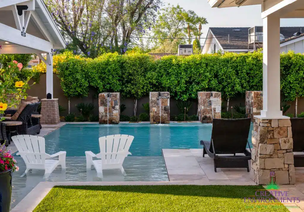 Backyard feature with water columns into pool