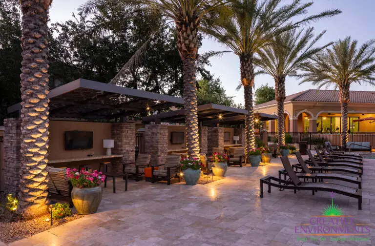 Custom community amenities with cantilevered shade structures, large planters and multiple outdoor seating areas.