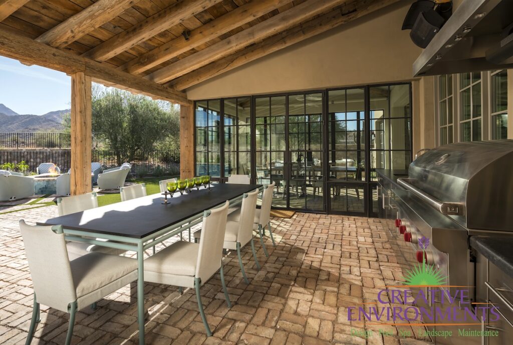 Custom indoor/outdoor fusion with outdoor dining area and pool.