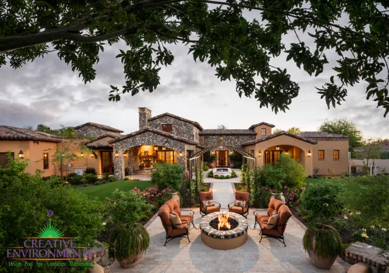 Backyard design with multiple seating areas, water fountain and fire pit.