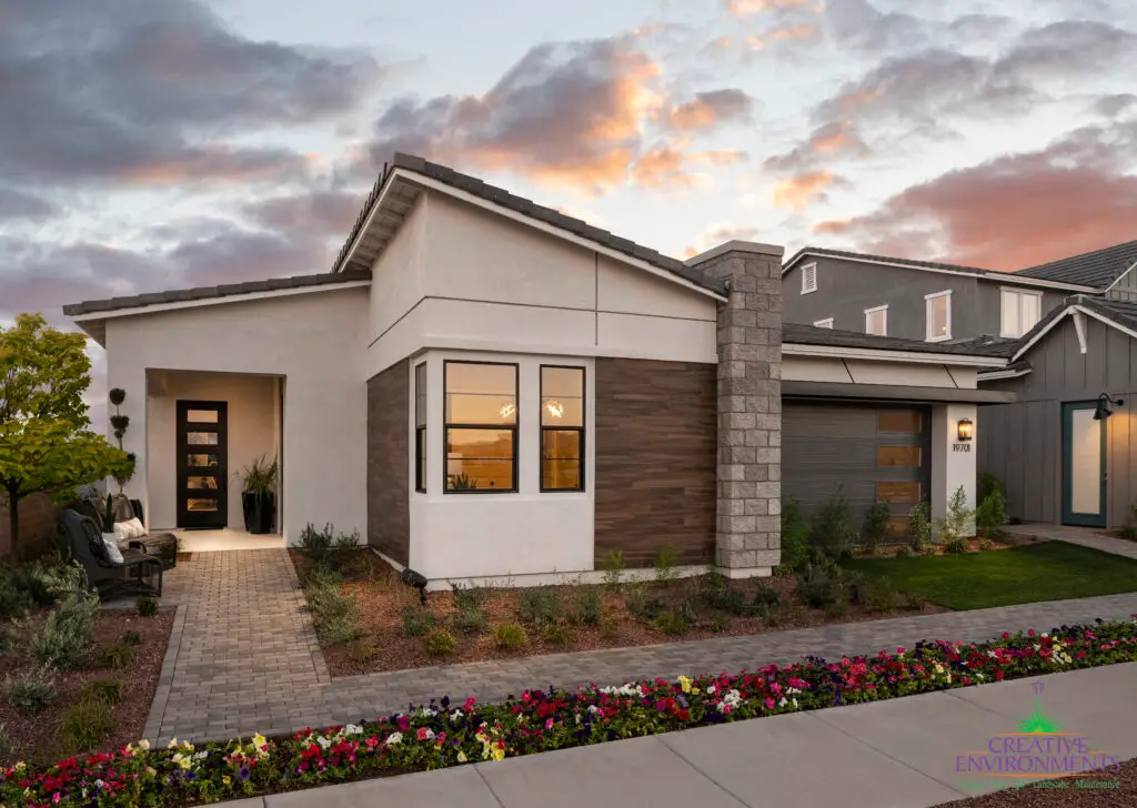 Custom front yard design with brick paver walkway, artificial turf and organized planting.