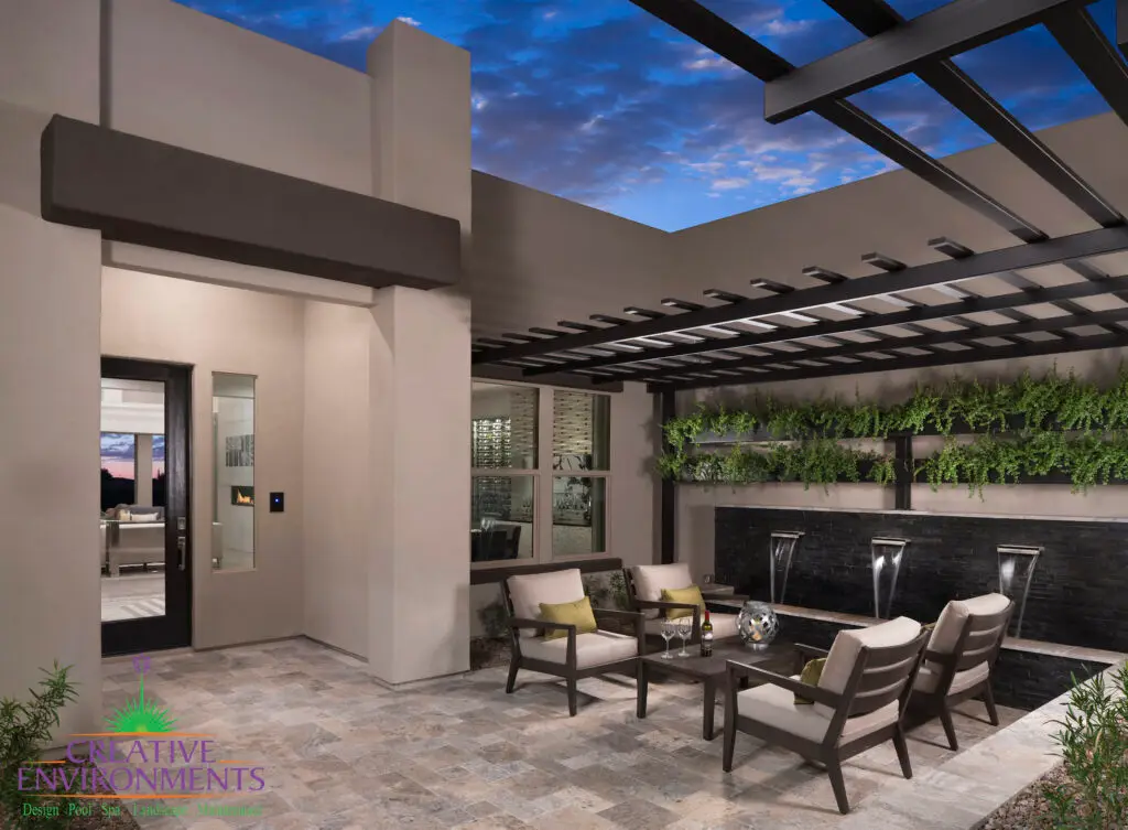 Custom entry way design with slatted metal shade structure, living wall and black water feature.
