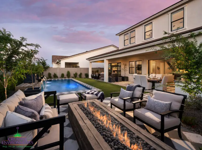 Backyard design with fire table and multiple seating areas