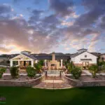 Custom community amenities with patterned turf, multiple seating areas and real grass.