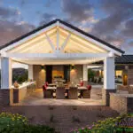 Custom community amenities with shade structure, outdoor dining area and fireplace.