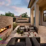 Custom backyard design with brick fireplace, beer tap water feature and outdoor seating areas.
