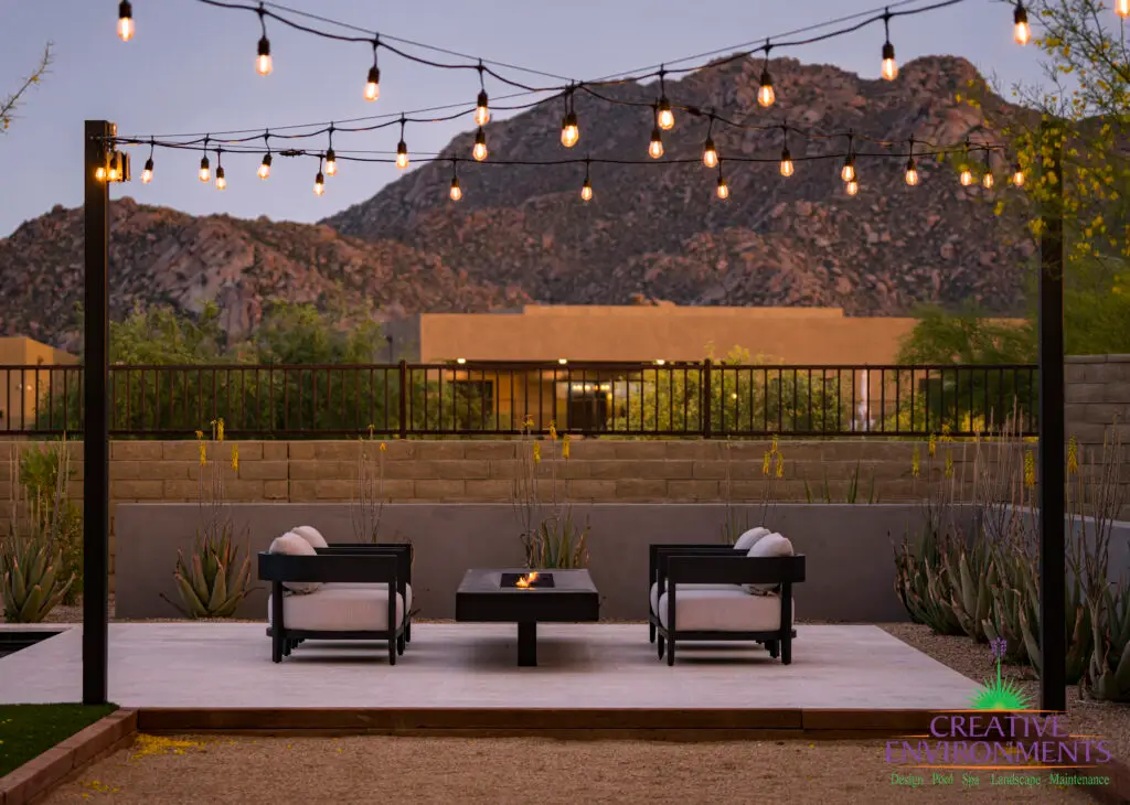 Custom backyard design with desert contemporary vibes, cantilevered fire table and outdoor seating area.