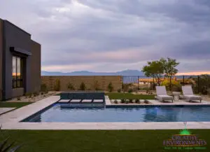 Custom backyard design with artificial turf, Jesus steps and pool.