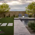 Custom backyard design desert landscape design, artificial turf and natural stone steps.