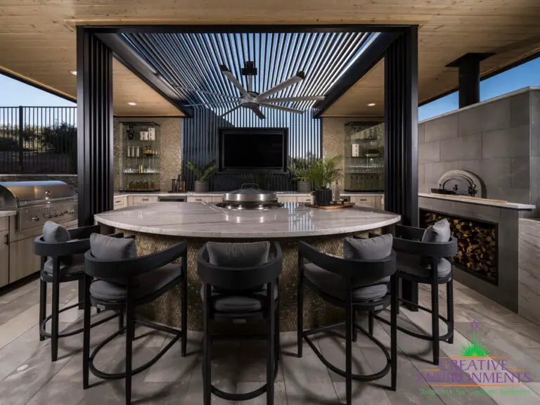Backyard design with outdoor dining area and outdoor fan.
