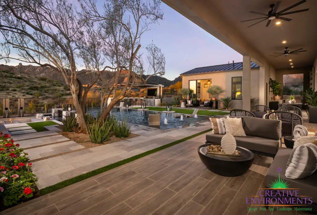 Backyard design with multiple seating areas and natural stone steps.