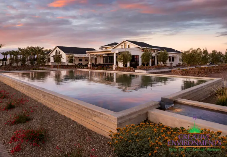 Custom community amenities with large water feature, clubhouse and multiple seating areas.