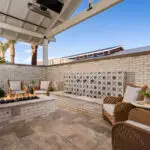 Custom community amenities with deco-tile water feature, fire pit and outdoor heaters.