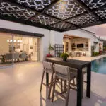 Custom backyard design with cantilevered metal shade structure that doubles as metal statement piece.