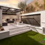 Backyard design with cantilevered shade structure and water feature