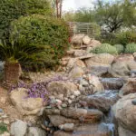 Backyard design with natural stone water fall.