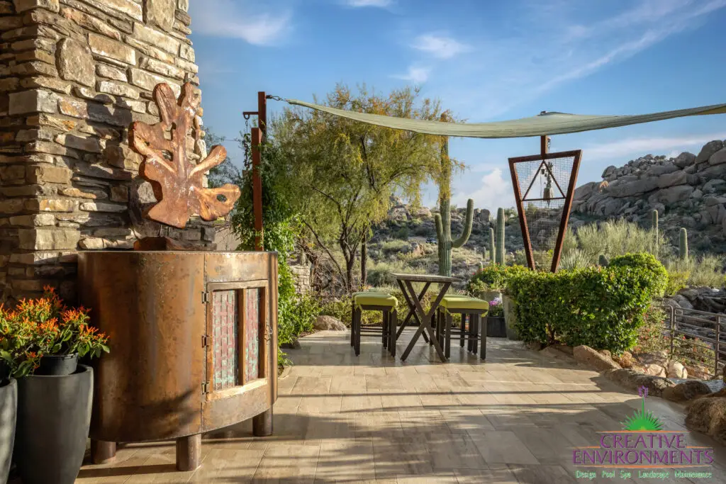 Backyard design with outdoor dining area and custom trellis.