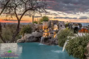 Backyard design with cacti and natural stone water fountain