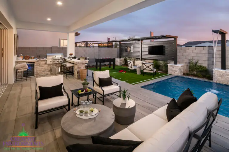 Backyard design with outdoor entertainment area and outdoor kitchen