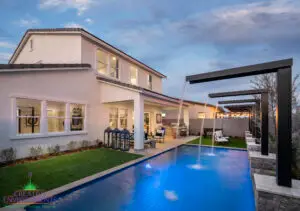 Backyard design with cantilevered water scuppers into pool