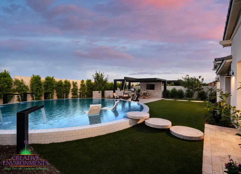 Custom backyard design with natural stone circular steps, circular pool and artificial turf.
