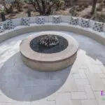 Custom backyard design with half-moon fire pit seating, large planters and desert contemporary vibes.