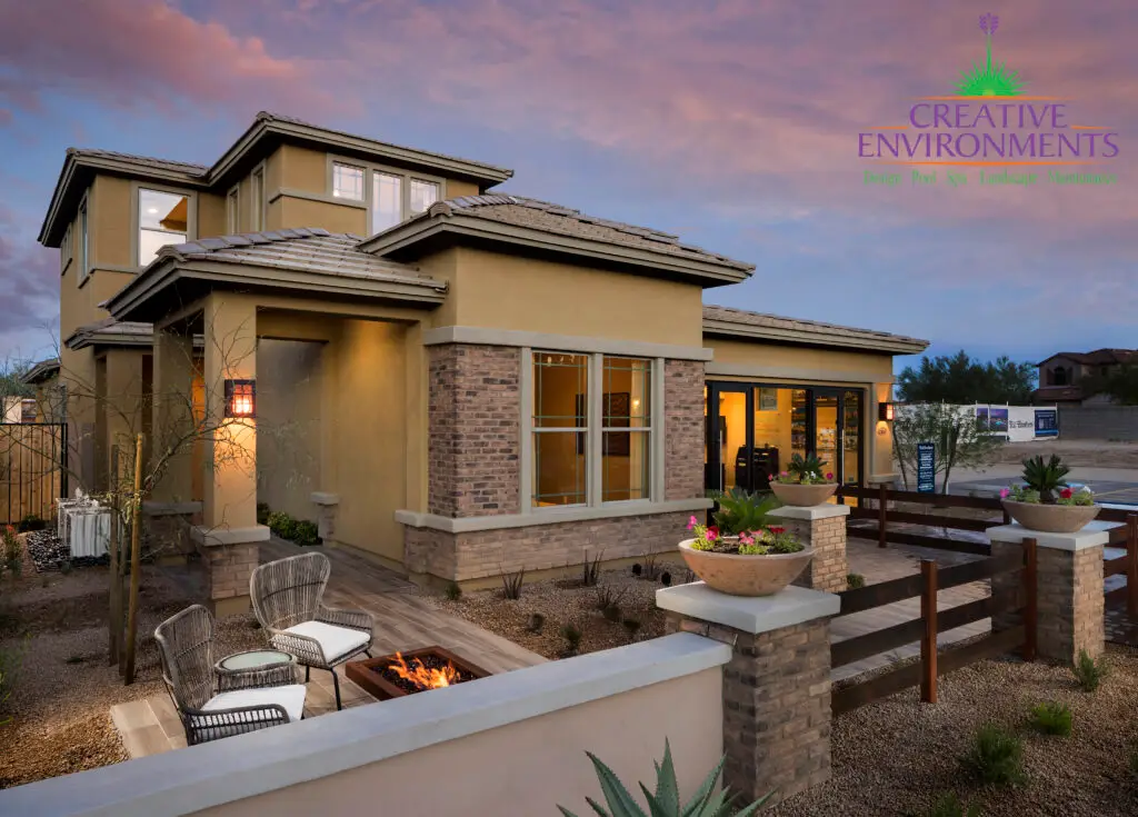 Custom front yard design with fire table, outdoor seating area and wok planters.