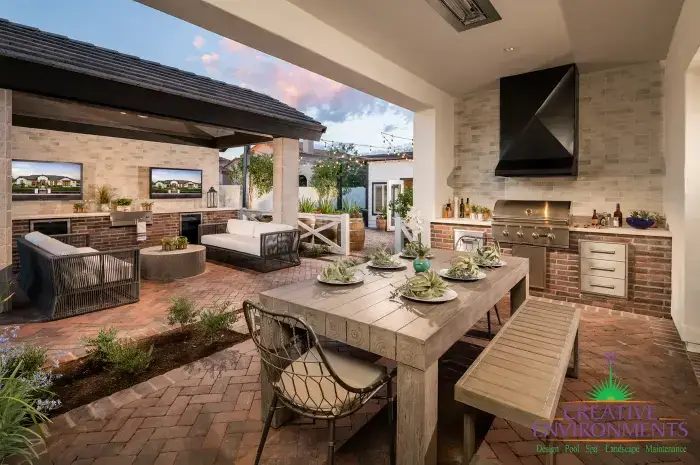 Backyard with hood, outdoor kitchen and multiple seating areas