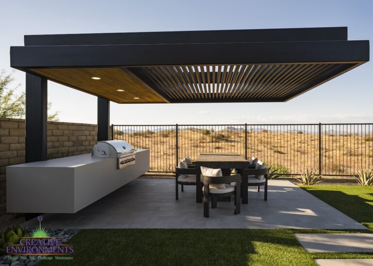 Custom backyard design with cantilevered shade structure, built-in BBQ and outdoor dining area.