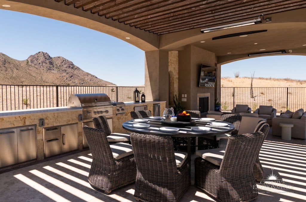 Custom backyard design with unique shade structure, multiple seating areas and outdoor kitchen.