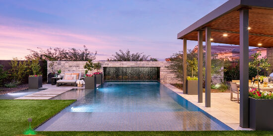 Custom backyard landscape with large pool and floating patio space near covered outdoor kitchen
