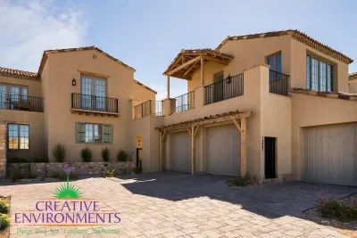 Custom front yard design with paver driveway.