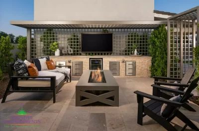 Custom backyard design with cantilevered shade structure, outdoor tv and fire table.
