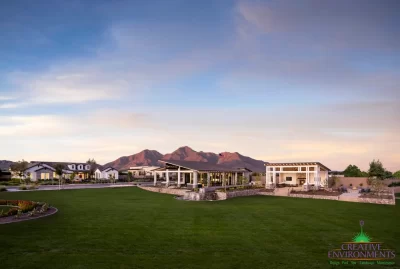 Custom community amenities with real grass, angled shade structure and multiple water features.