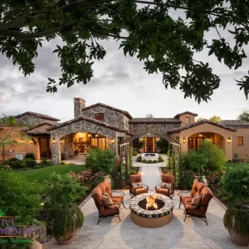 Backyard design with multiple seating areas, water fountain and fire pit.