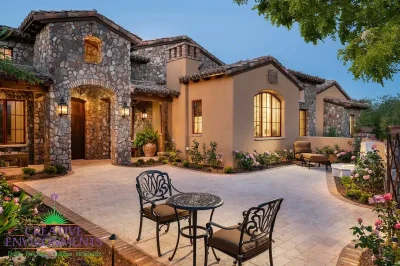 Front yard design with courtyard, multiple seating areas and flowers.