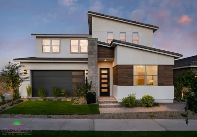 Custom front yard design with organized planting, artificial turf and up lighting.