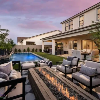 Backyard design with fire table and multiple seating areas