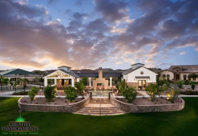 Custom community amenities with patterned turf, multiple seating areas and real grass.