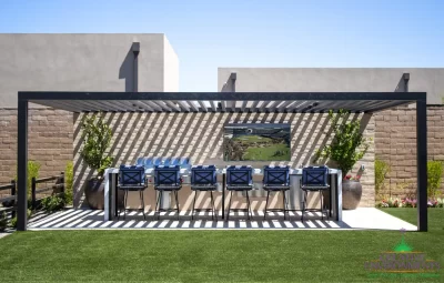 Custom backyard design with bar seating, outdoor TV and slatted metal shade structure.