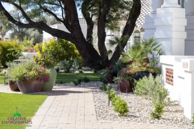 Front yard design with pavers and organized planting