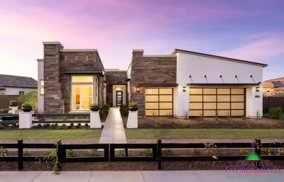 Front yard design with desert plants and real grass.